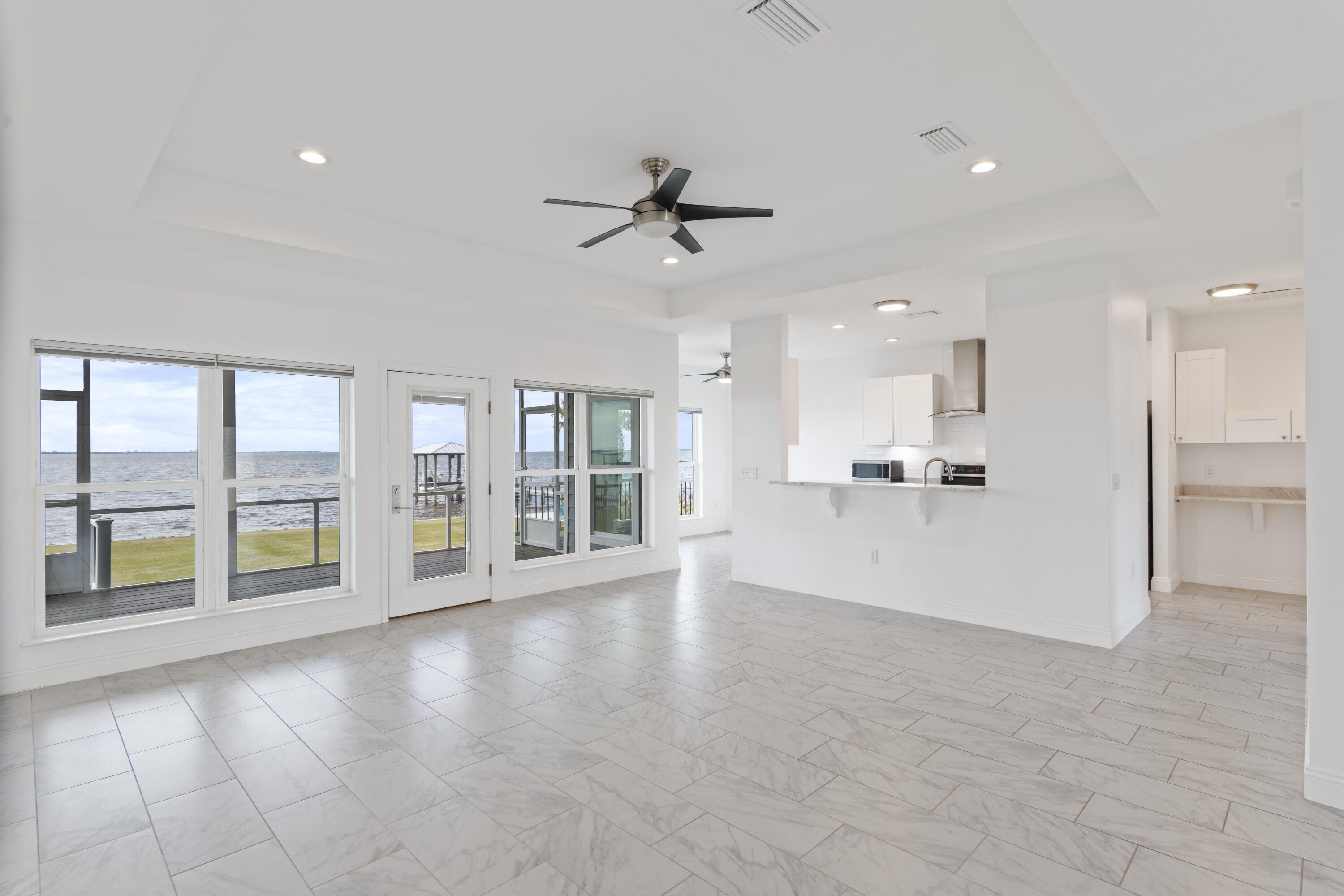10 South Sunset Harbour Freeport, FL 32439 - Photo 13 of 57 a view of an empty room with a window and a kitchen view