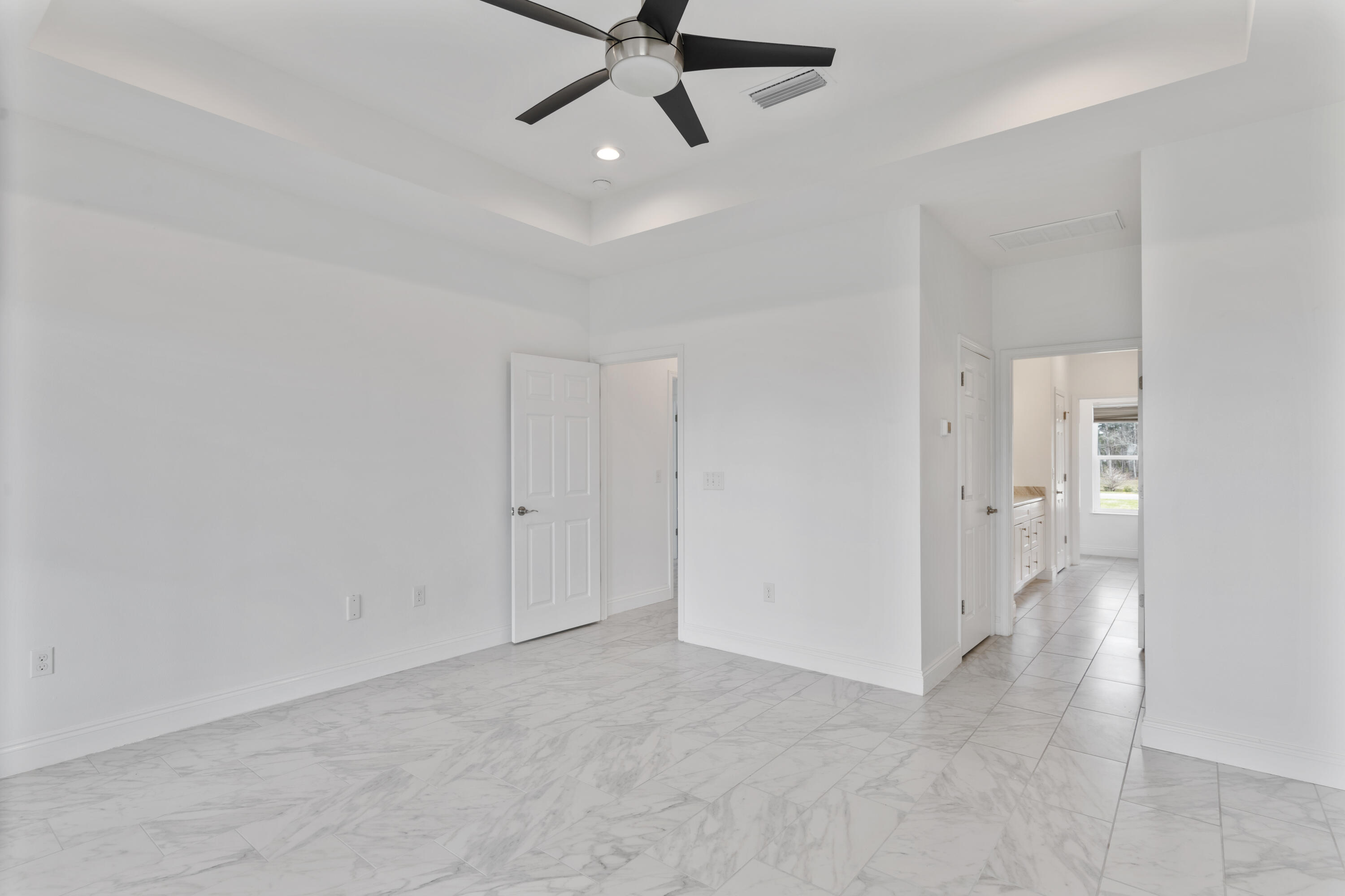 10 South Sunset Harbour Freeport, FL 32439 - Photo 36 of 57 a view of a room with an empty space and a ceiling fan