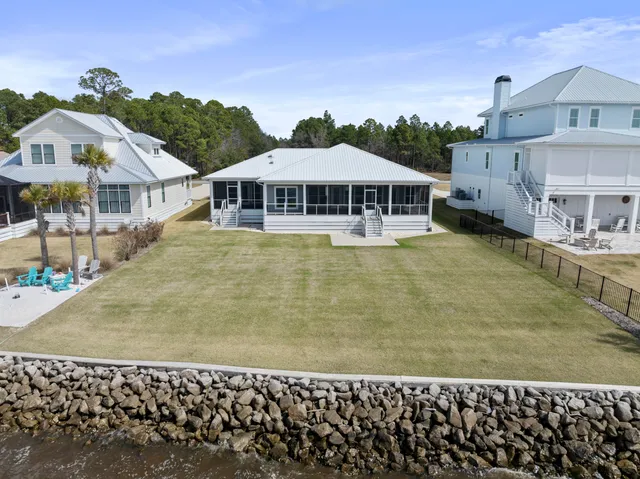 a view of a swimming pool with a yard