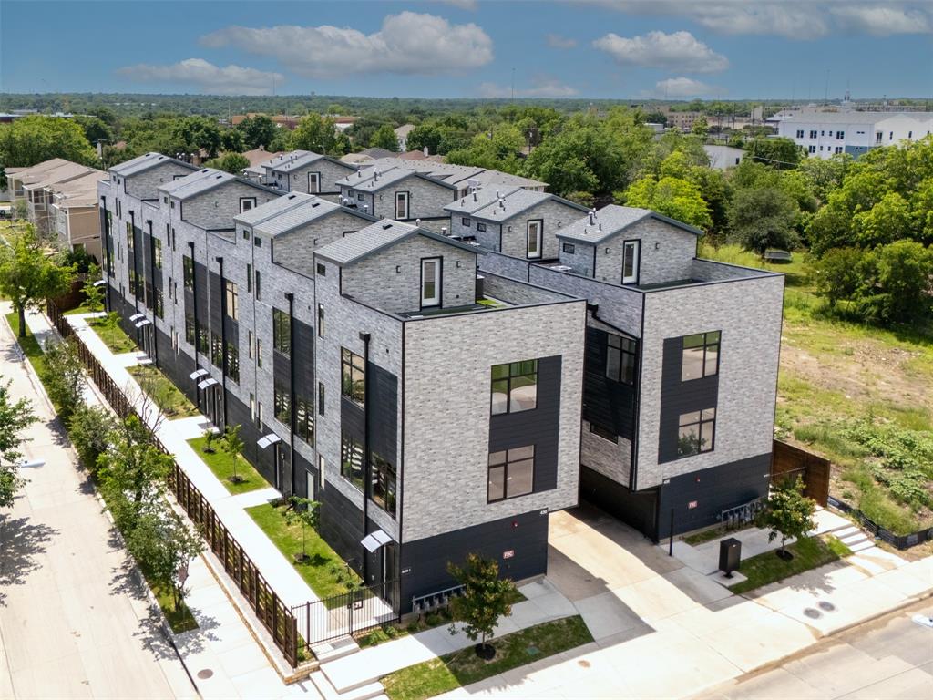 430 East 8th Street, Unit 201 Dallas, TX 75203 - Photo 3 of 26 a aerial view of a brick house with a yard in front of it