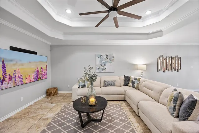 a living room with furniture and a rug