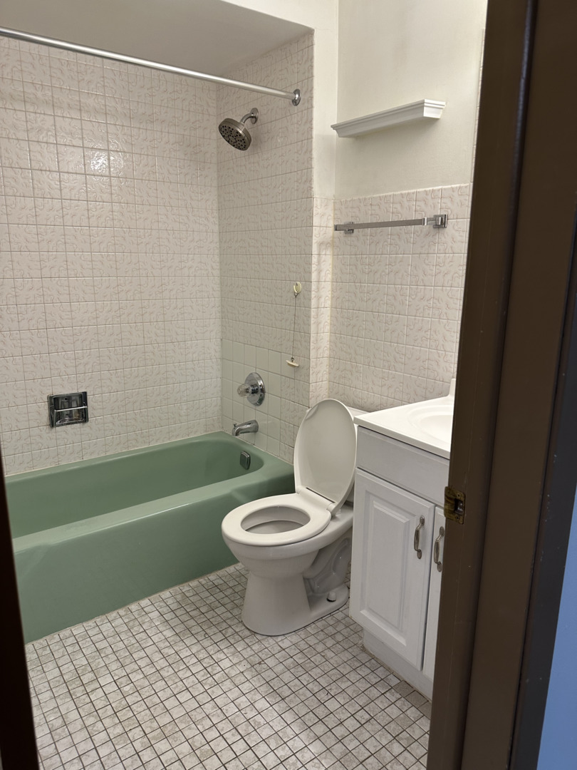 8020 West 84th Street Justice, IL 60458 - Photo 6 of 17 a bathroom with a toilet and a shower