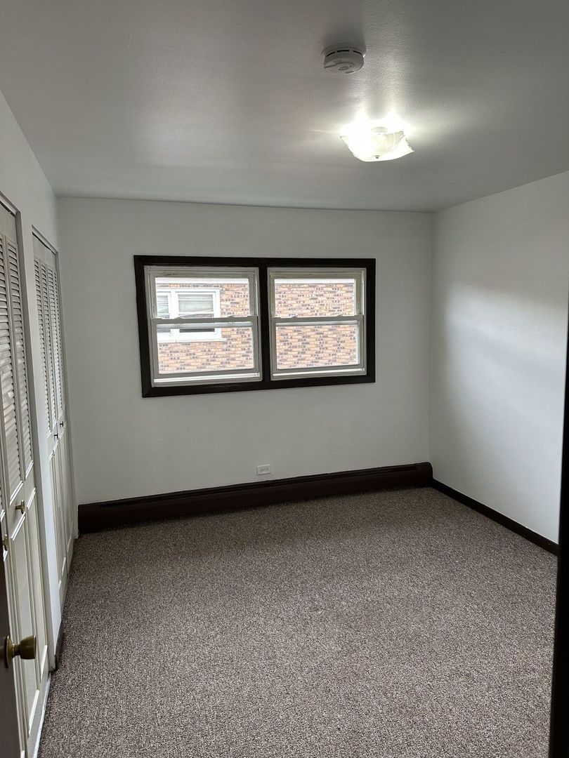 8020 West 84th Street Justice, IL 60458 - Photo 9 of 17 an empty room with windows