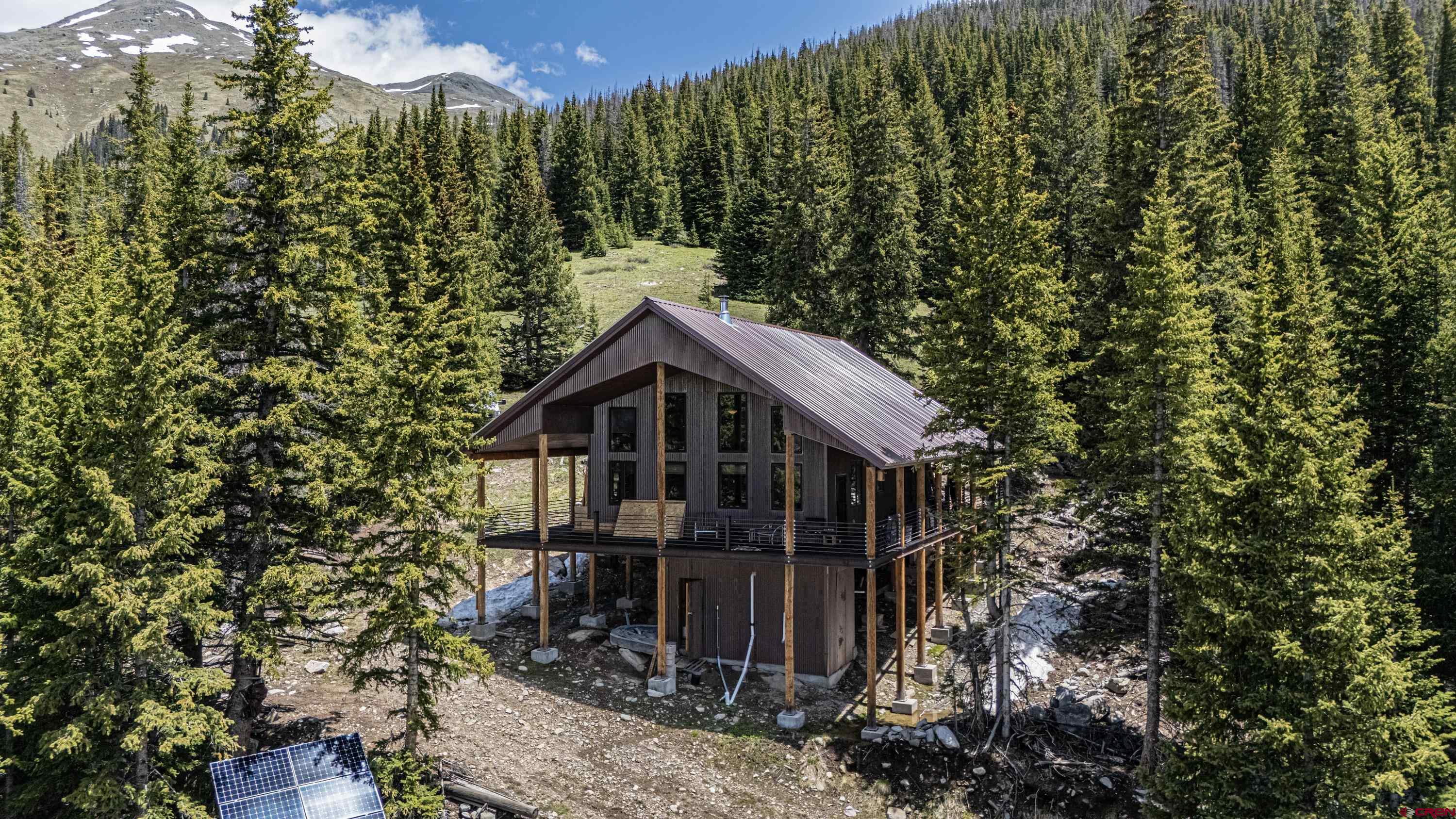 3300 County Road Silverton, CO 81433 - Photo 1 of 30 a view of a house with a yard and large trees