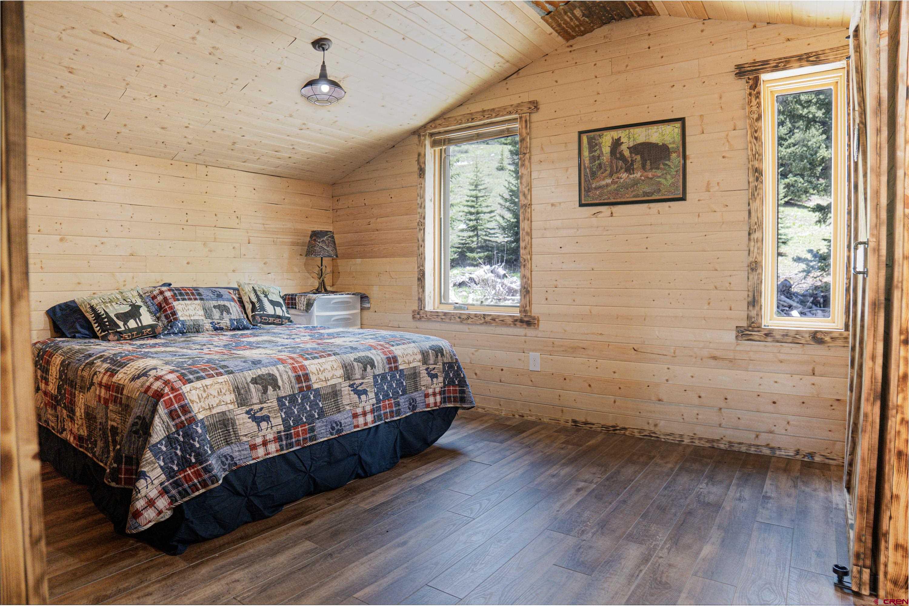 3300 County Road Silverton, CO 81433 - Photo 16 of 30 a bedroom with a bed and a window