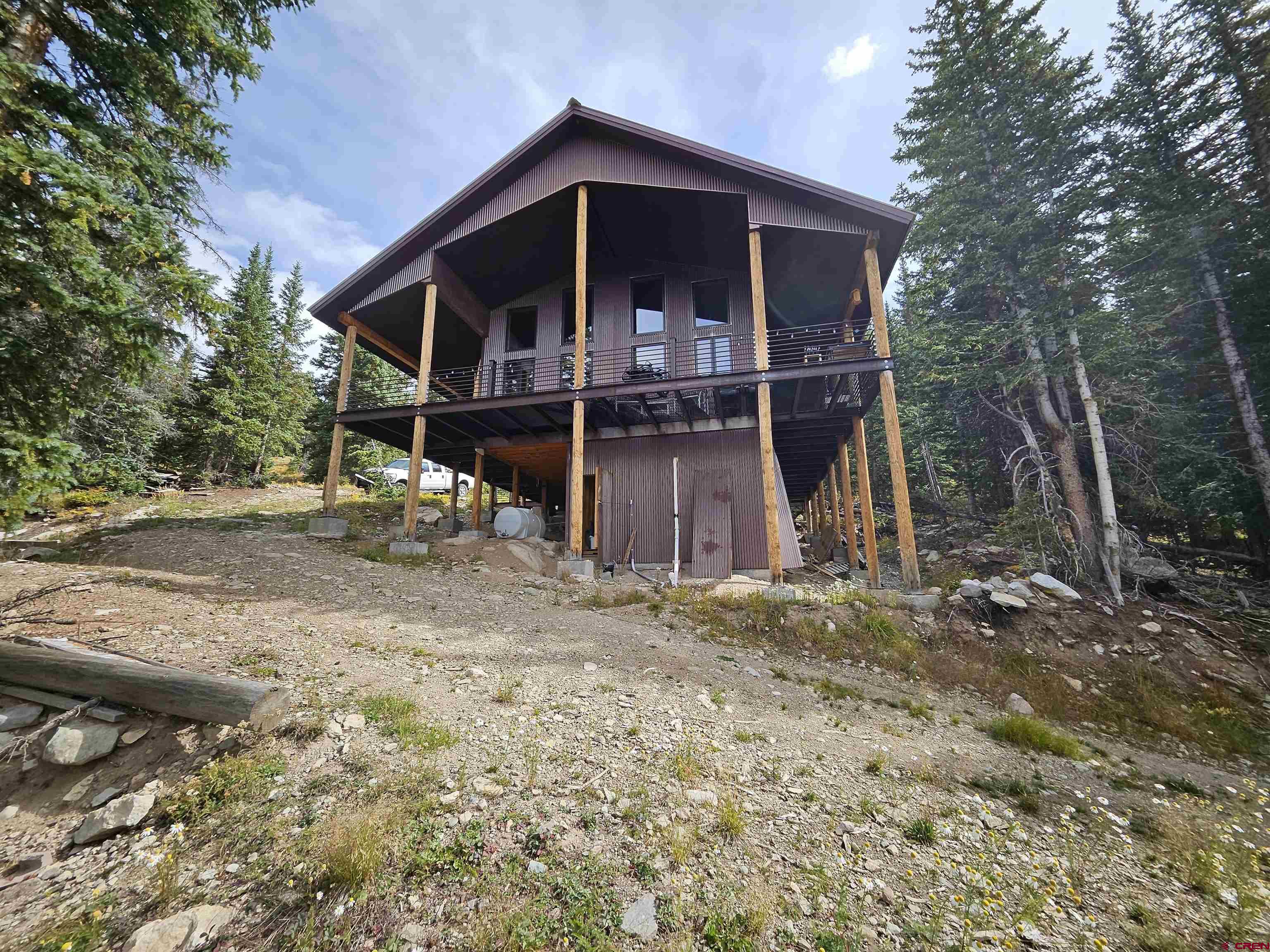 3300 County Road Silverton, CO 81433 - Photo 2 of 30 a view of a house with a yard and large tree