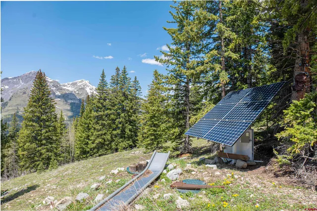 a view of a backyard with sitting area