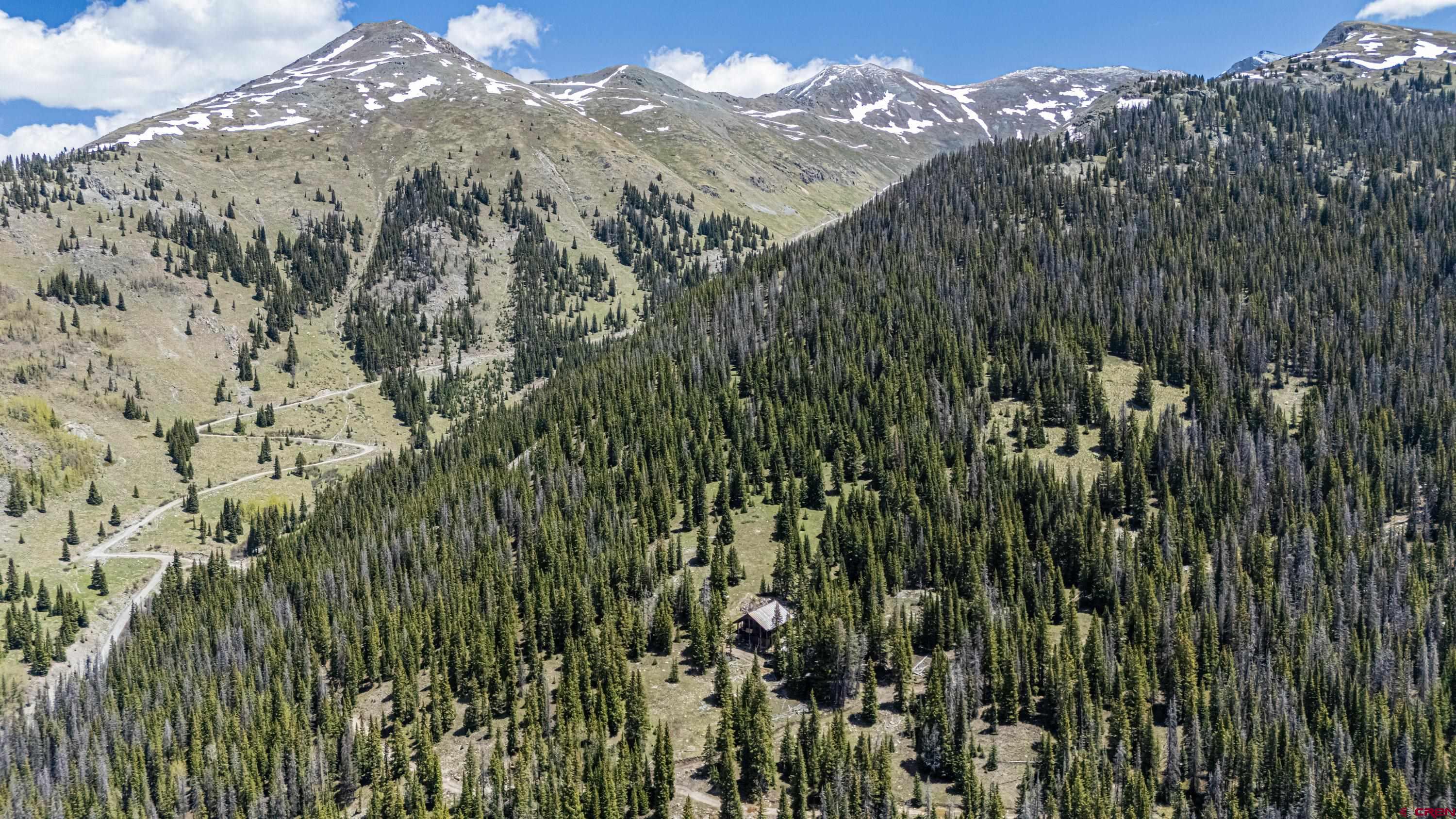 3300 County Road Silverton, CO 81433 - Photo 25 of 30 a view of a houses of a city with lush green forest