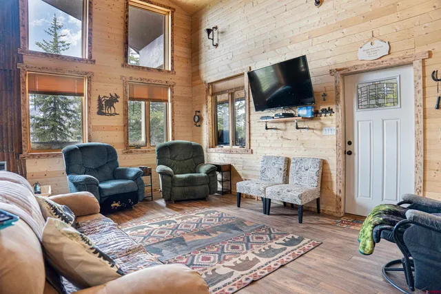 a living room with furniture fireplace and flat screen tv
