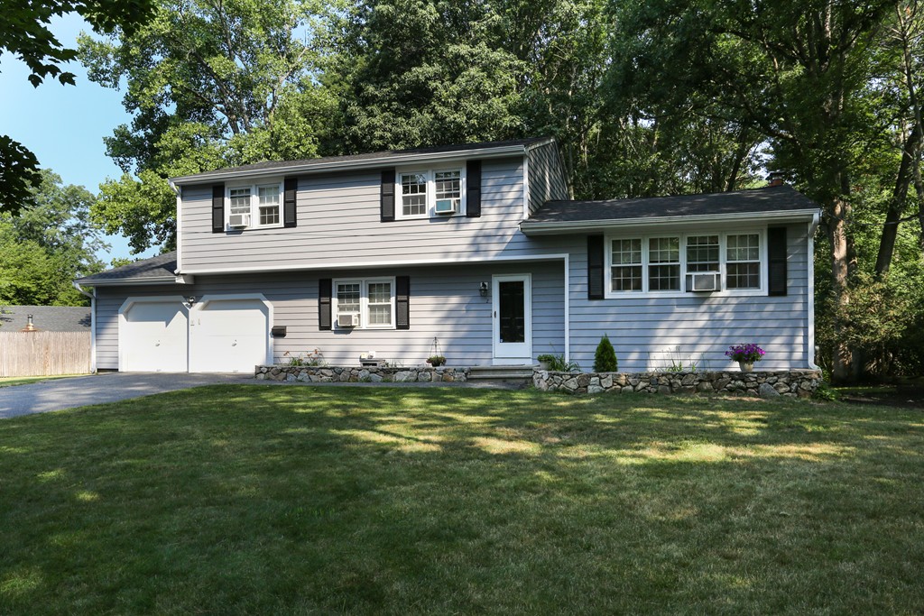 2 Woodside Road Framingham, MA 01701 - Photo 1 of 29 a front view of a house with a garden