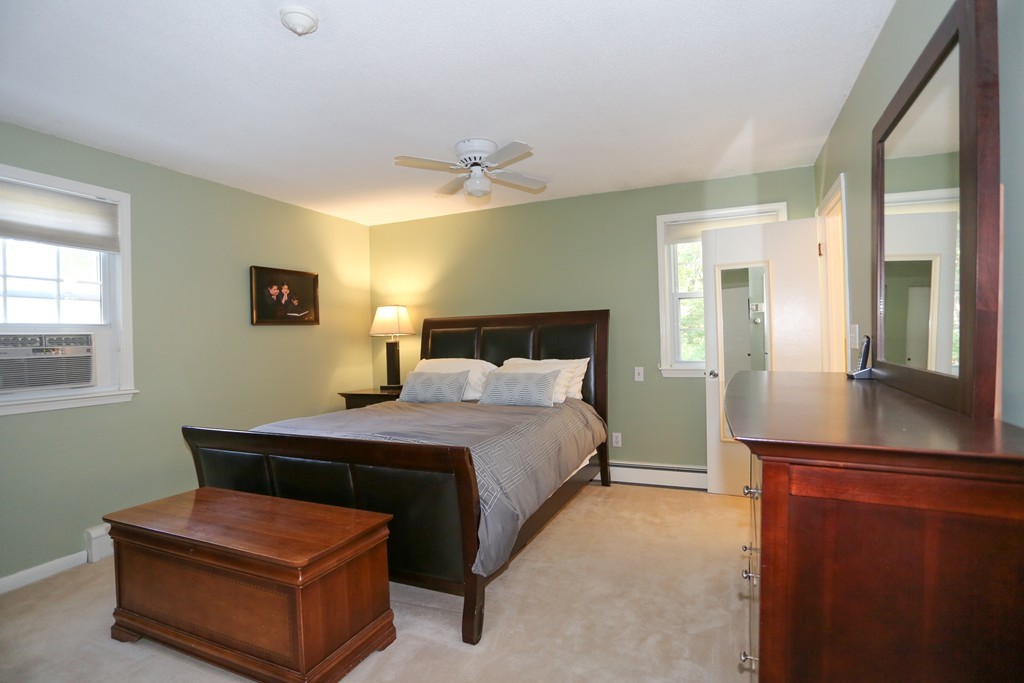 2 Woodside Road Framingham, MA 01701 - Photo 16 of 29 a bedroom with a bed and a mirror