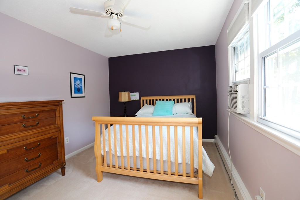 2 Woodside Road Framingham, MA 01701 - Photo 19 of 29 a bed sitting in a bedroom next to a window