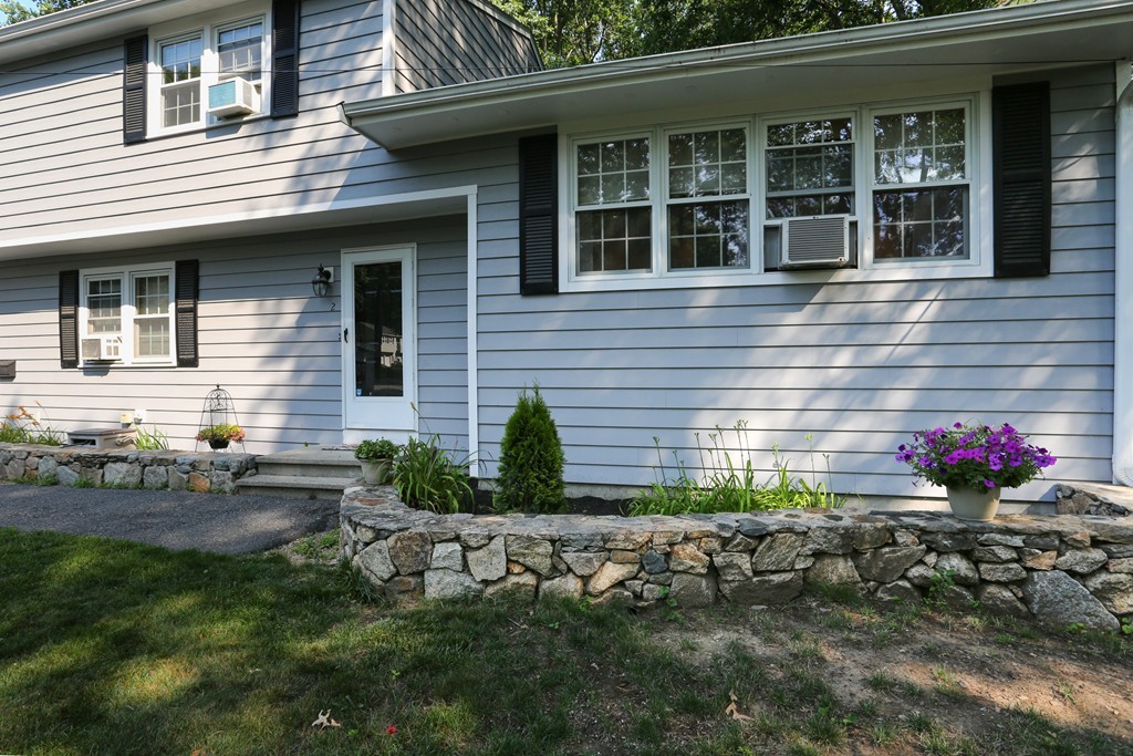 2 Woodside Road Framingham, MA 01701 - Photo 2 of 29 a front view of a house with a yard