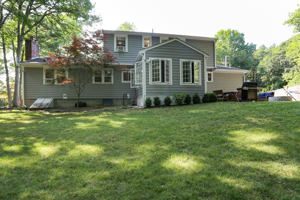 2 Woodside Road Framingham, MA 01701 - Photo 28 of 29 a front view of a house with a garden