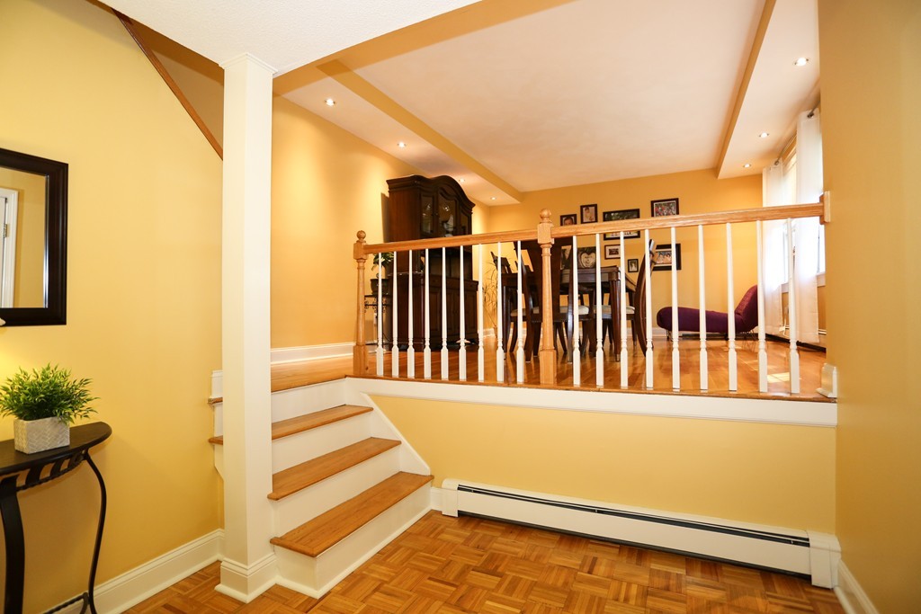 2 Woodside Road Framingham, MA 01701 - Photo 3 of 29 a view of a door with wooden floor and a window