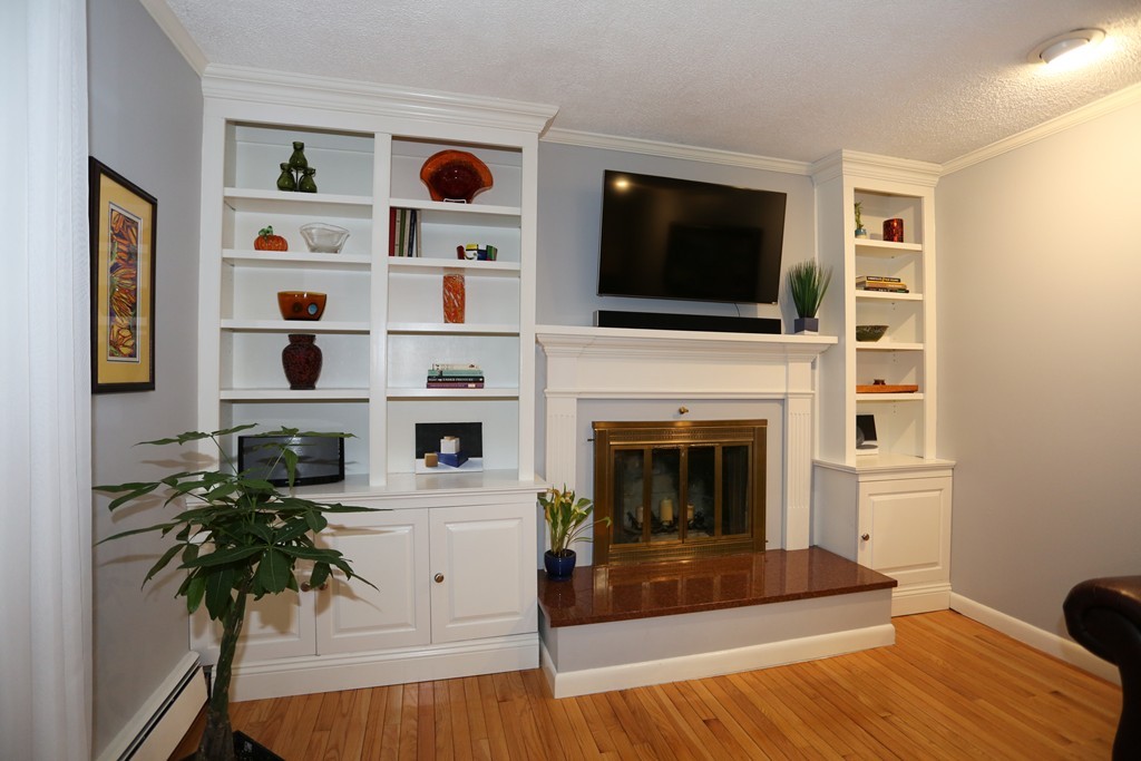 2 Woodside Road Framingham, MA 01701 - Photo 7 of 29 a living room with furniture fireplace and flat screen tv