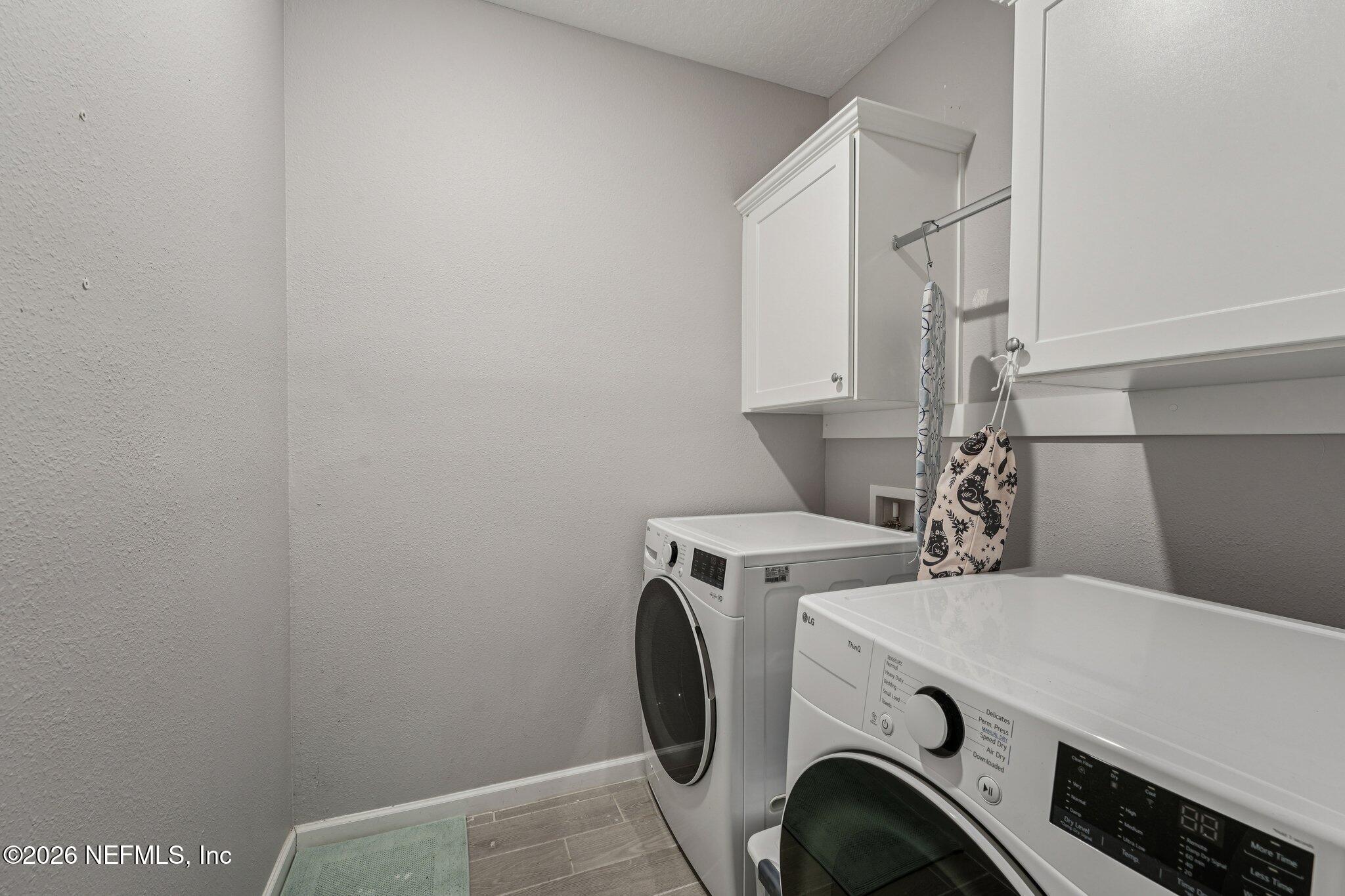 75682 Pondside Lane Yulee, FL 32097 - Photo 15 of 35 a utility room with dryer and washer