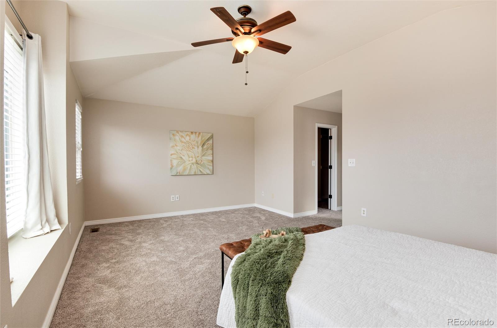 9866 Spring Hill Lane Highlands Ranch, CO 80129 - Photo 24 of 49 a bedroom with a bed and a window