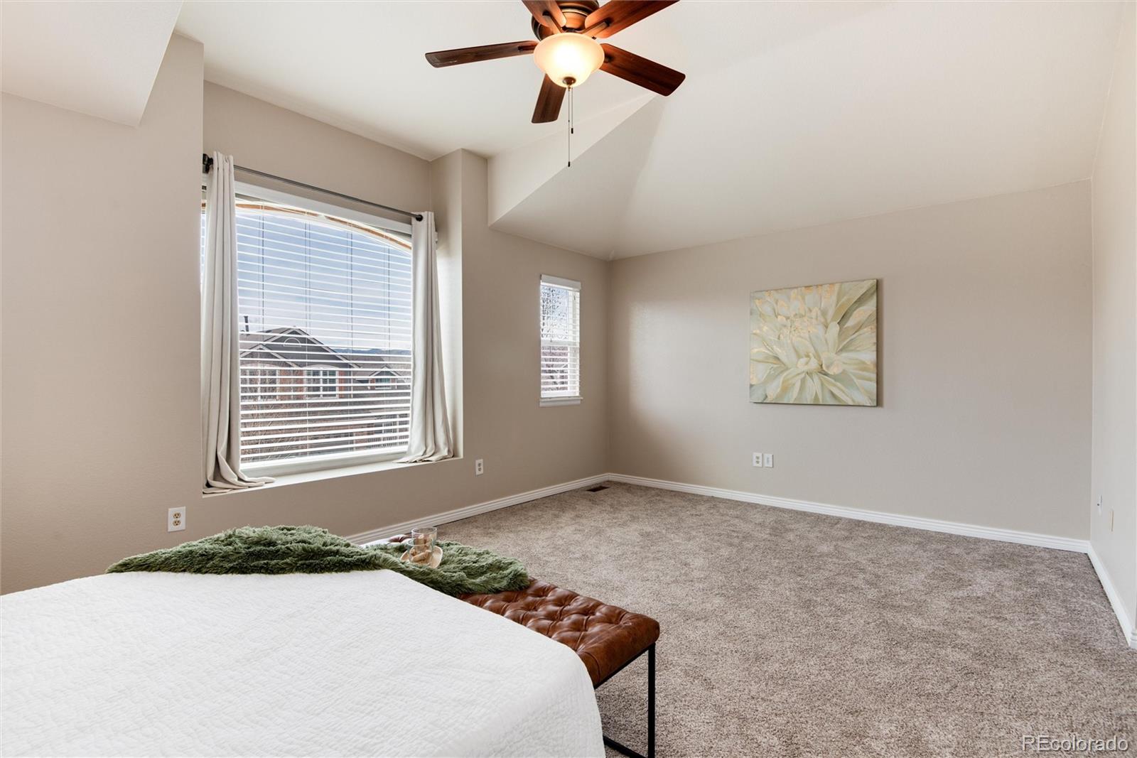 9866 Spring Hill Lane Highlands Ranch, CO 80129 - Photo 25 of 49 a bedroom with a bed and a window