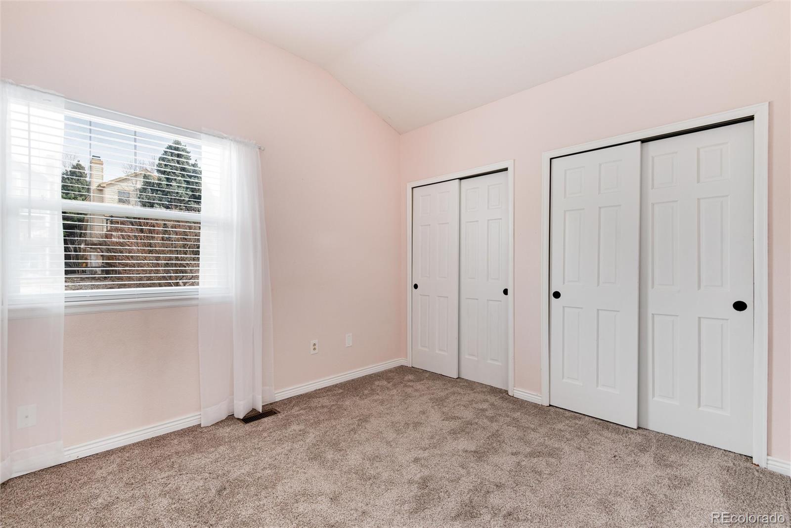 9866 Spring Hill Lane Highlands Ranch, CO 80129 - Photo 30 of 49 a view of an empty room with a window