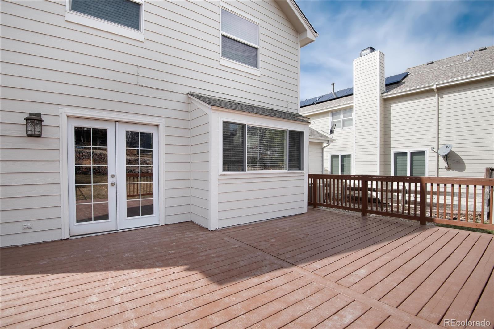 9866 Spring Hill Lane Highlands Ranch, CO 80129 - Photo 43 of 49 a view of a house with wooden floor