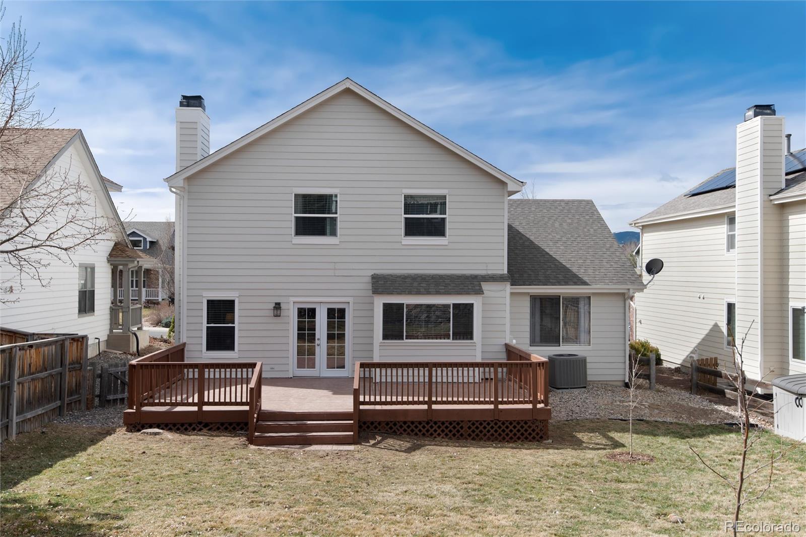 9866 Spring Hill Lane Highlands Ranch, CO 80129 - Photo 46 of 49 a view of a house with a yard