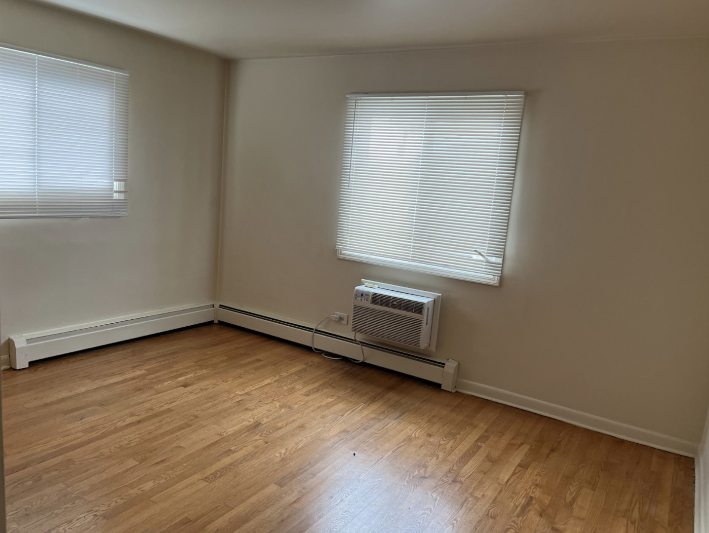 200 South Boulevard, Unit 2C Evanston, IL 60202 - Photo 11 of 16 an empty room with wooden floor and windows