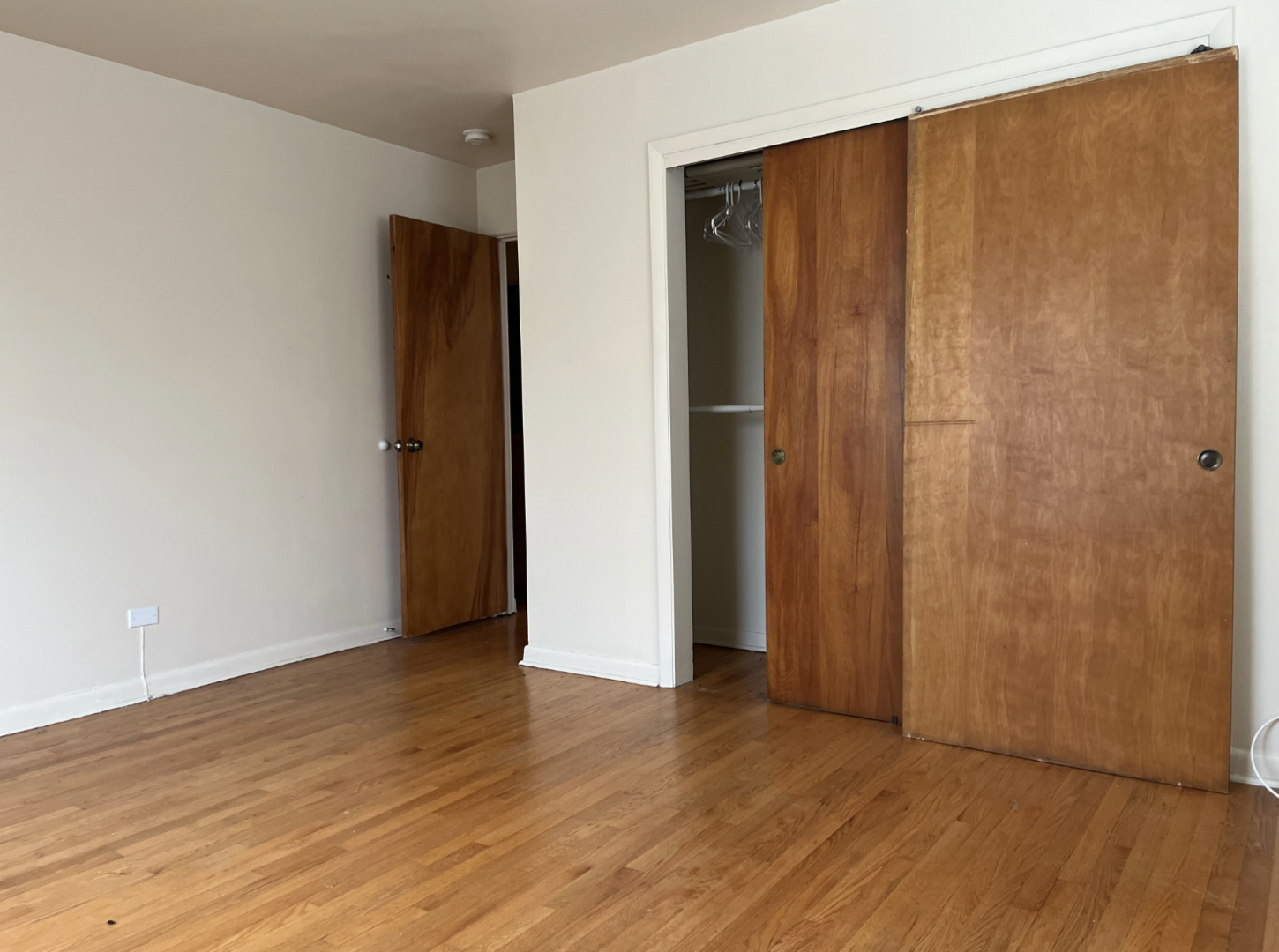 200 South Boulevard, Unit 2C Evanston, IL 60202 - Photo 12 of 16 an empty room with wooden floor and closet area