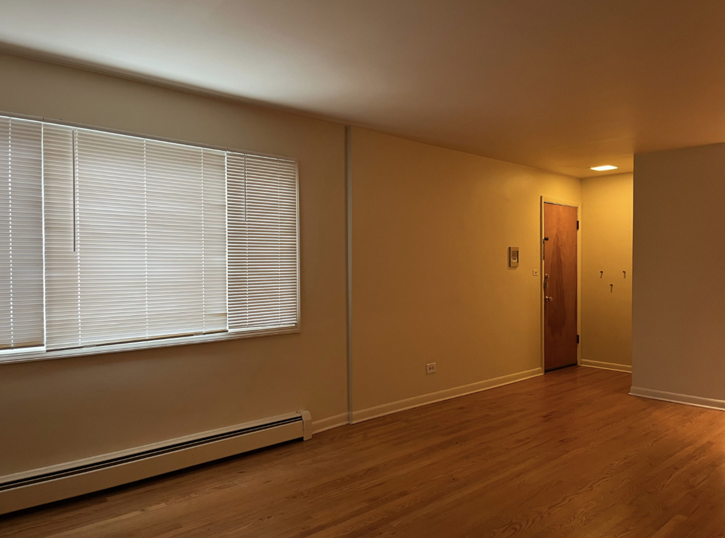 200 South Boulevard, Unit 2C Evanston, IL 60202 - Photo 3 of 16 an empty room with wooden floor and windows