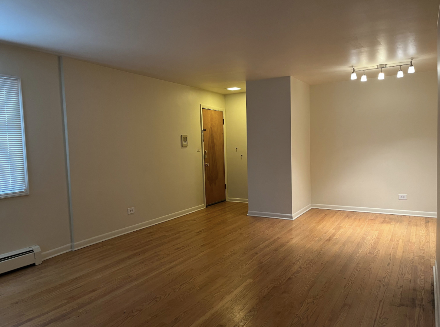 200 South Boulevard, Unit 2C Evanston, IL 60202 - Photo 4 of 16 an empty room with wooden floor and windows