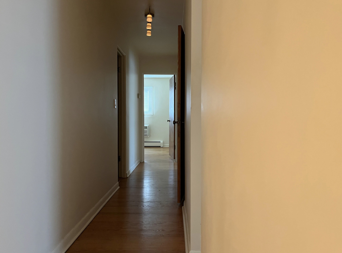 200 South Boulevard, Unit 2C Evanston, IL 60202 - Photo 7 of 16 a view of a hallway with a wooden floor