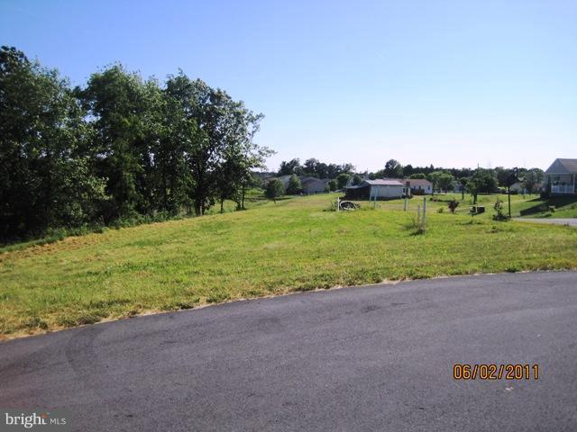 Lair Inwood, WV 25428 - Photo 5 of 8 a view of a field with a trees in the background