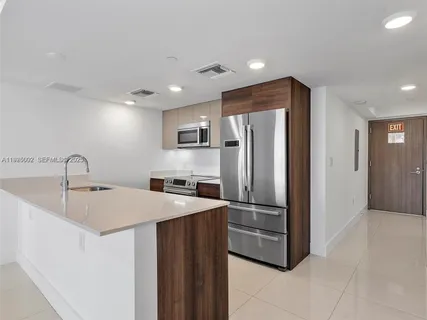 a view of a big room with closet and windows
