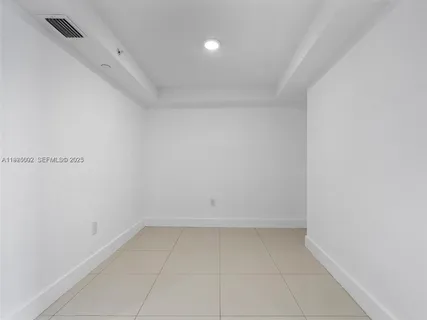 a kitchen with stainless steel appliances granite countertop a stove and a refrigerator