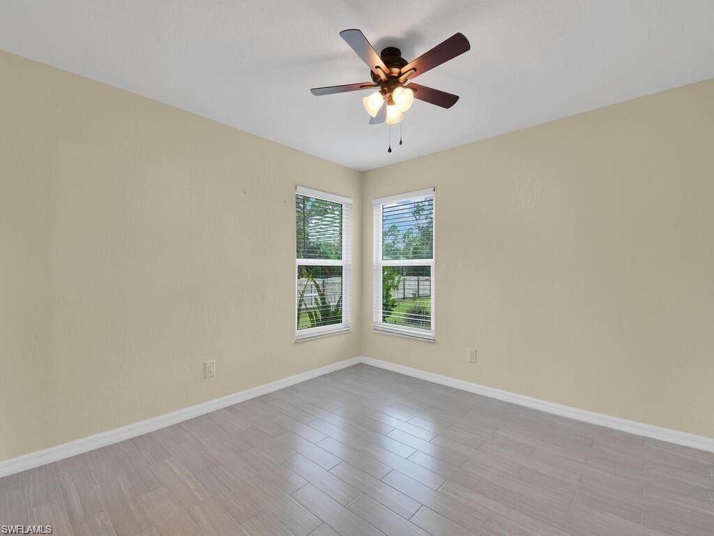 260 12th Street Southeast Naples, FL 34117 - Photo 15 of 29 an empty room with a window