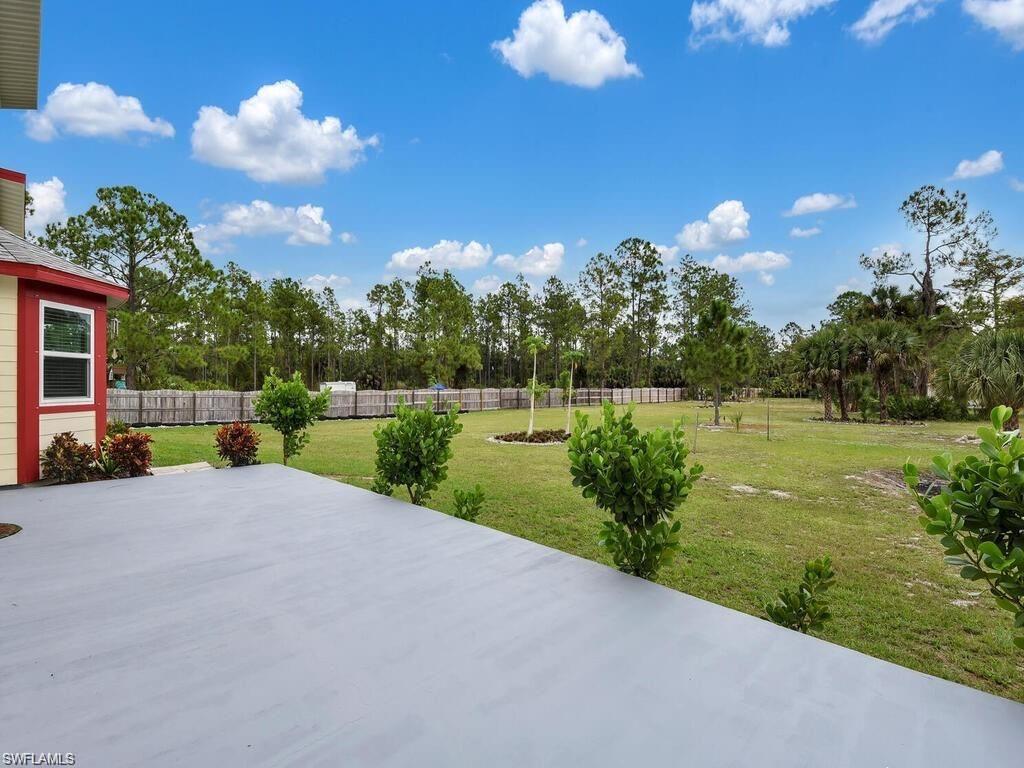 260 12th Street Southeast Naples, FL 34117 - Photo 21 of 29 a view of a lake with a garden