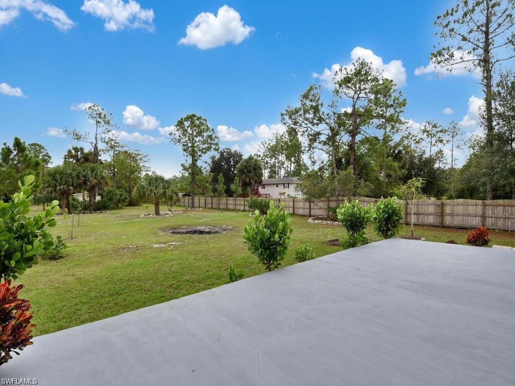 260 12th Street Southeast Naples, FL 34117 - Photo 23 of 29 a view of a house with a big yard