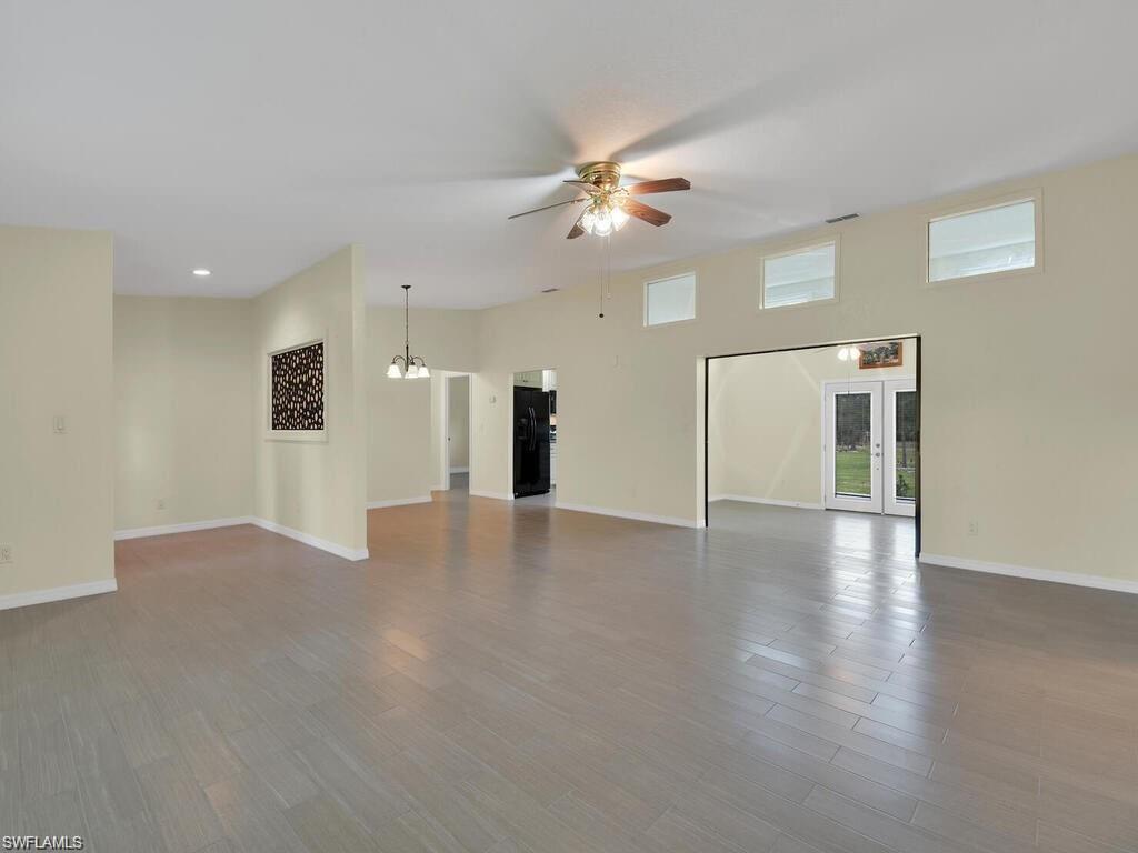 260 12th Street Southeast Naples, FL 34117 - Photo 4 of 29 a view of a livingroom with a ceiling fan window and wooden floor