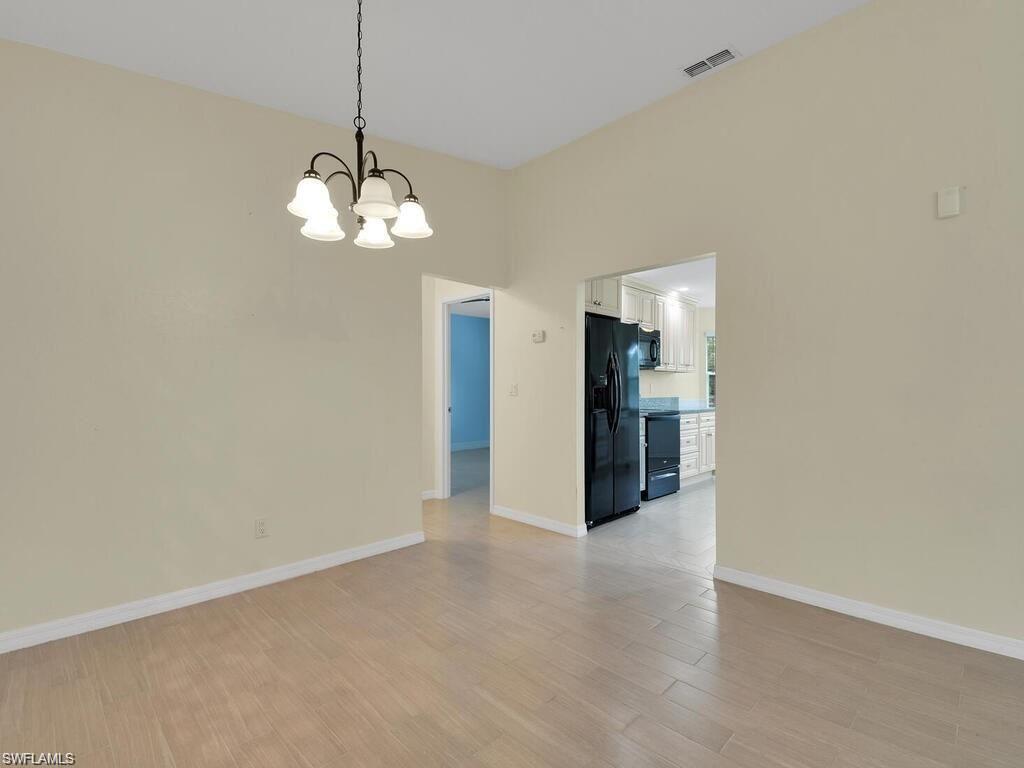 260 12th Street Southeast Naples, FL 34117 - Photo 7 of 29 a view of a chandelier in big room and chandelier