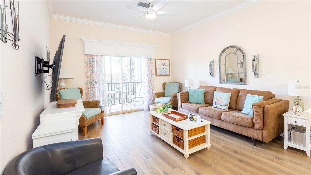 205 Watling Way, Unit 24205 Davenport, FL 33897 - Photo 11 of 58 a living room with furniture and a window