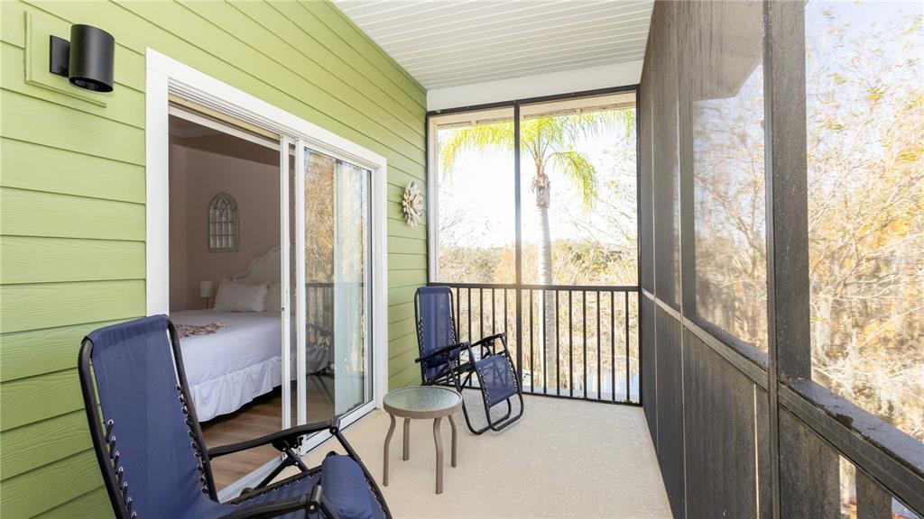 205 Watling Way, Unit 24205 Davenport, FL 33897 - Photo 15 of 58 a view of a balcony with furniture and wooden floor
