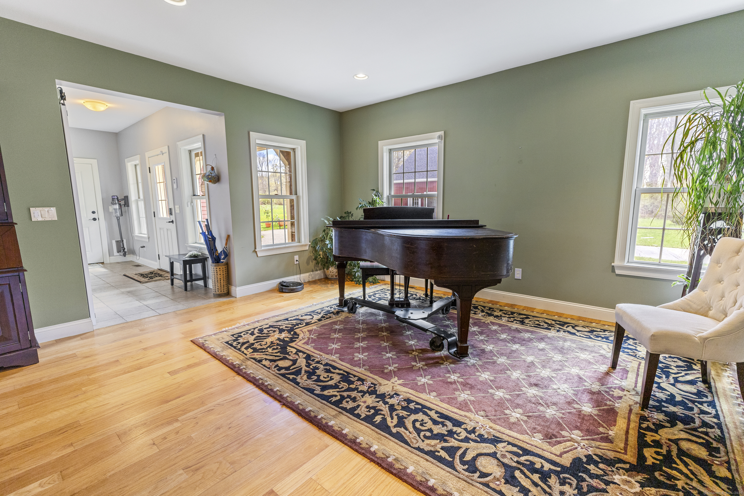 267 Chase Road Thompson, CT 06277 - Photo 13 of 32 a living room with a rug table and a window