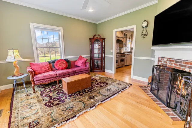 a living room with furniture rug and a flat screen tv