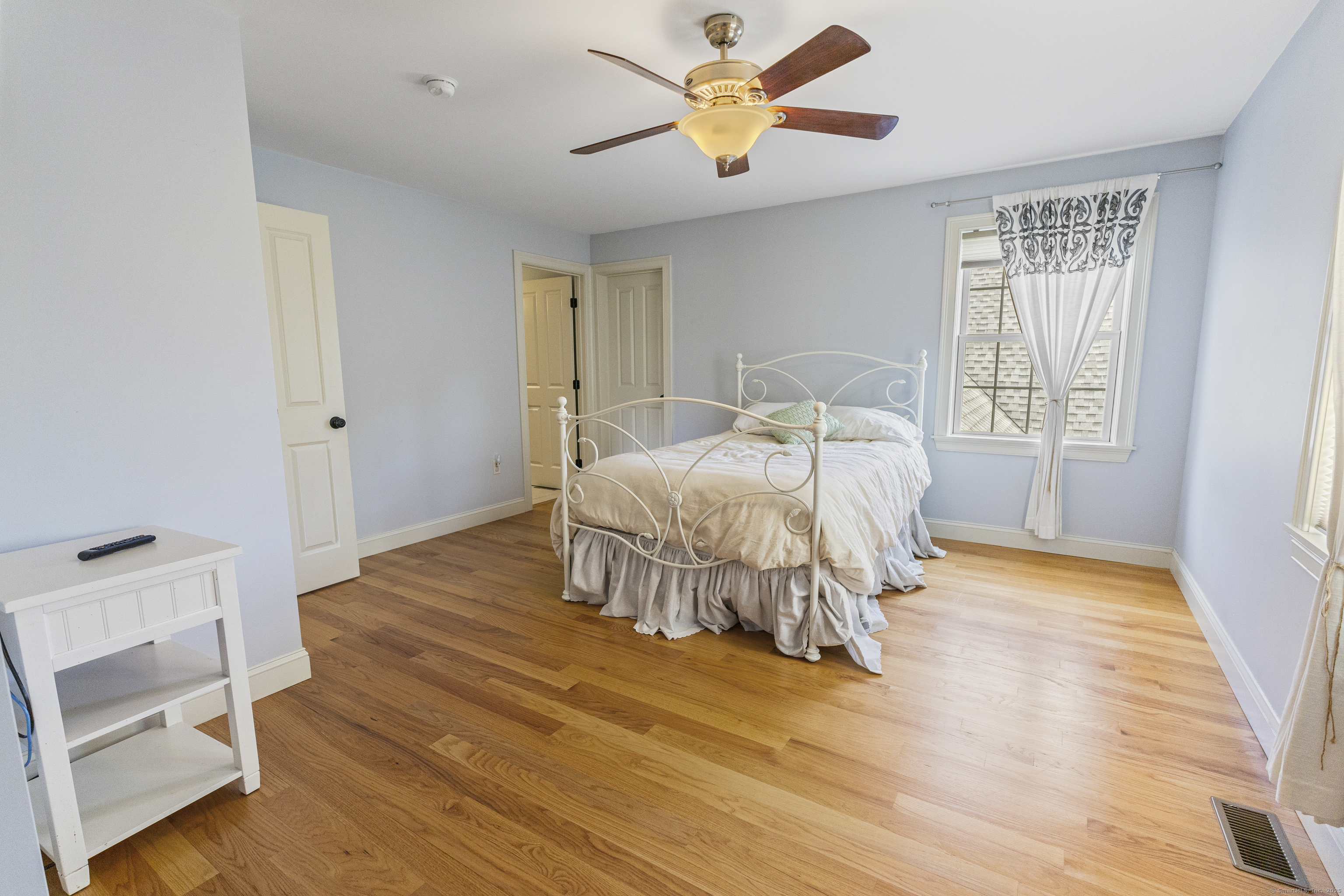 267 Chase Road Thompson, CT 06277 - Photo 19 of 32 a bedroom with a bed and a window