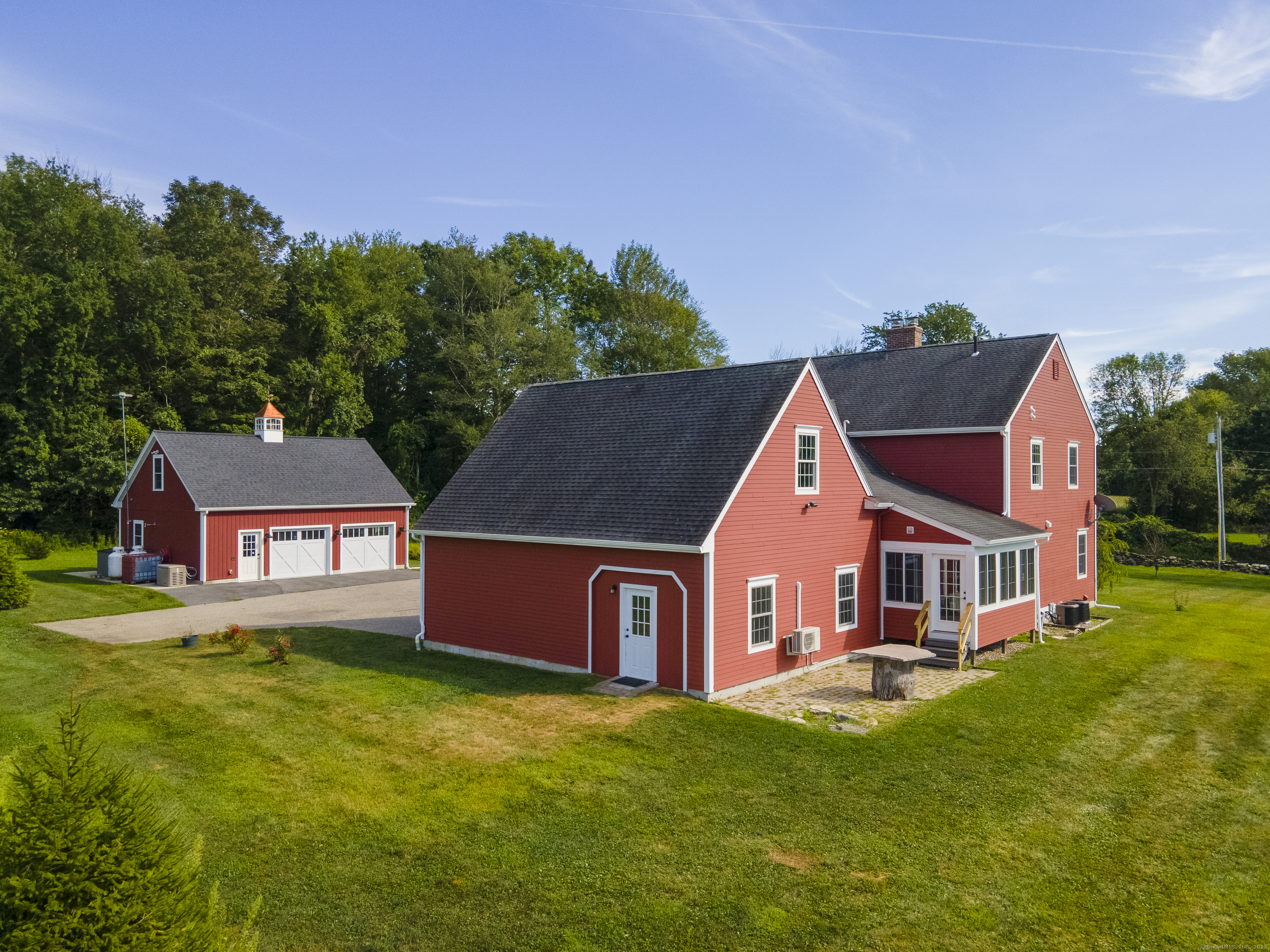 267 Chase Road Thompson, CT 06277 - Photo 2 of 32 a front view of house with yard and trees in the background