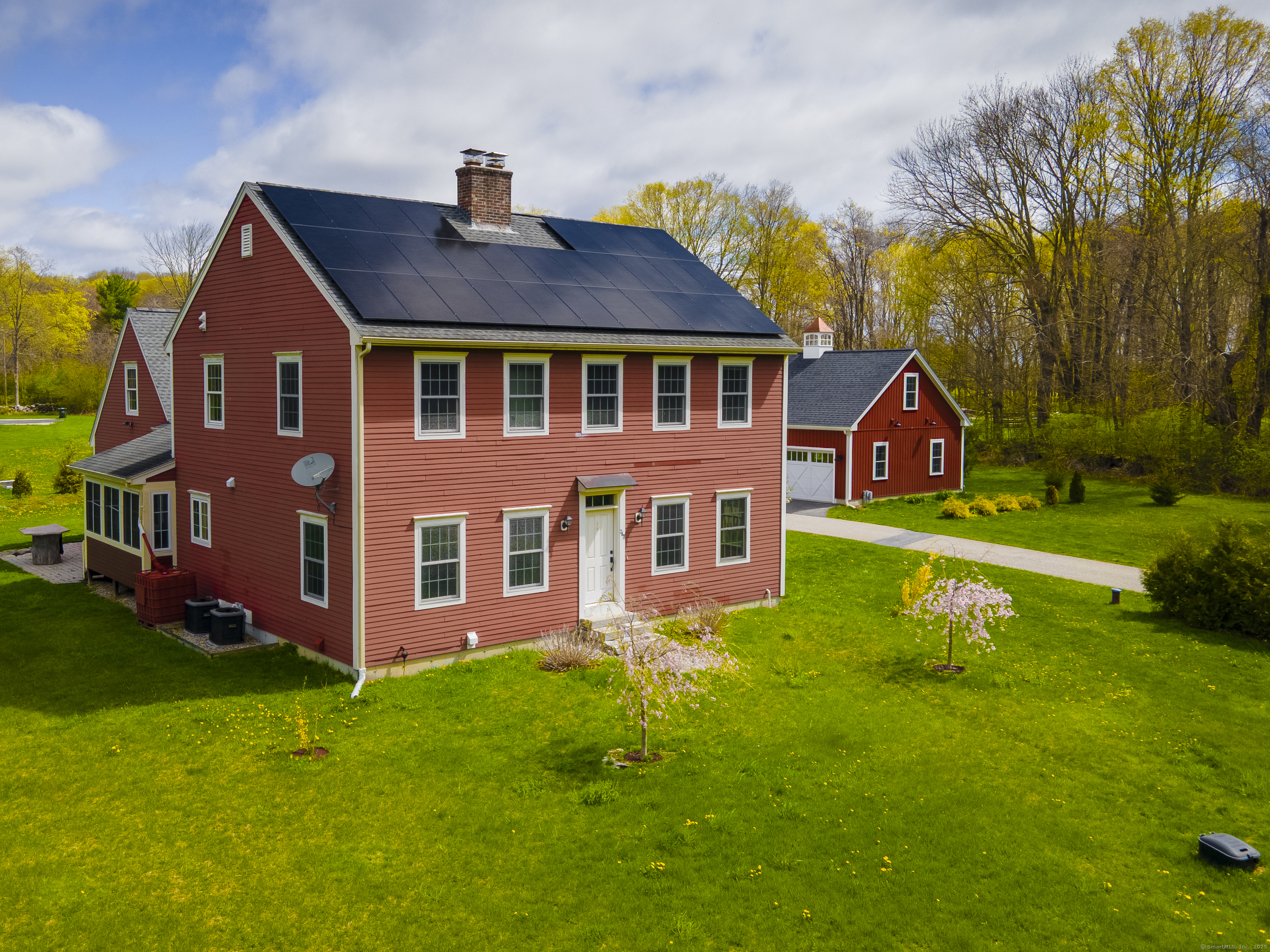 267 Chase Road Thompson, CT 06277 - Photo 3 of 32 a front view of a house with garden