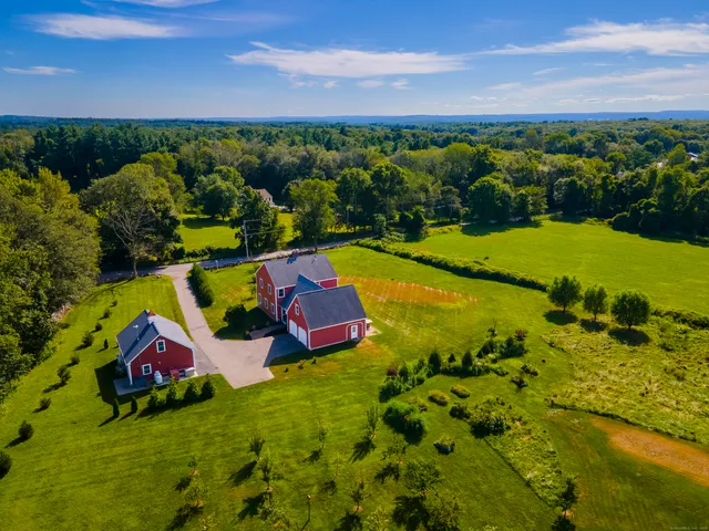 a view of swimming pool with outdoor seating and yard