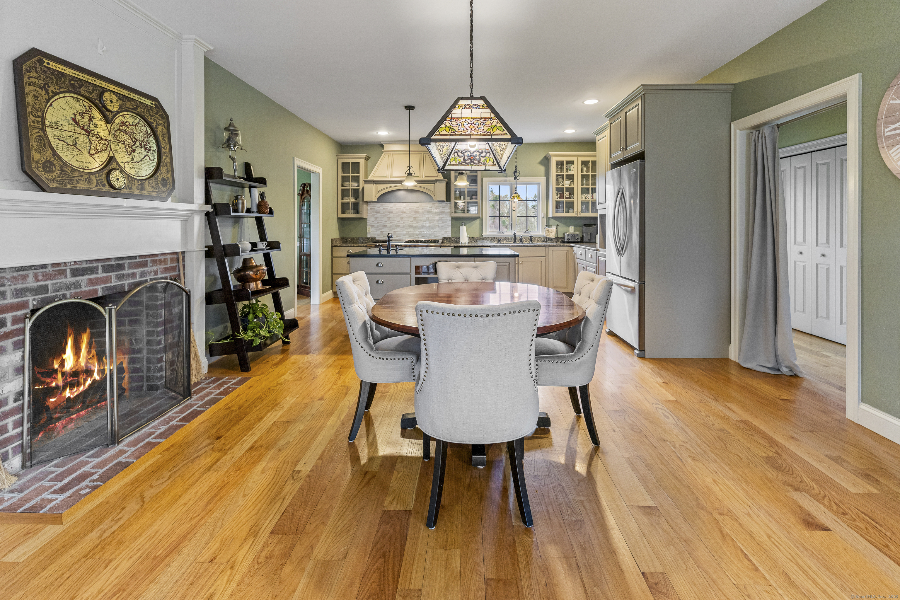 267 Chase Road Thompson, CT 06277 - Photo 8 of 32 a view of a dining room with furniture window and wooden floor