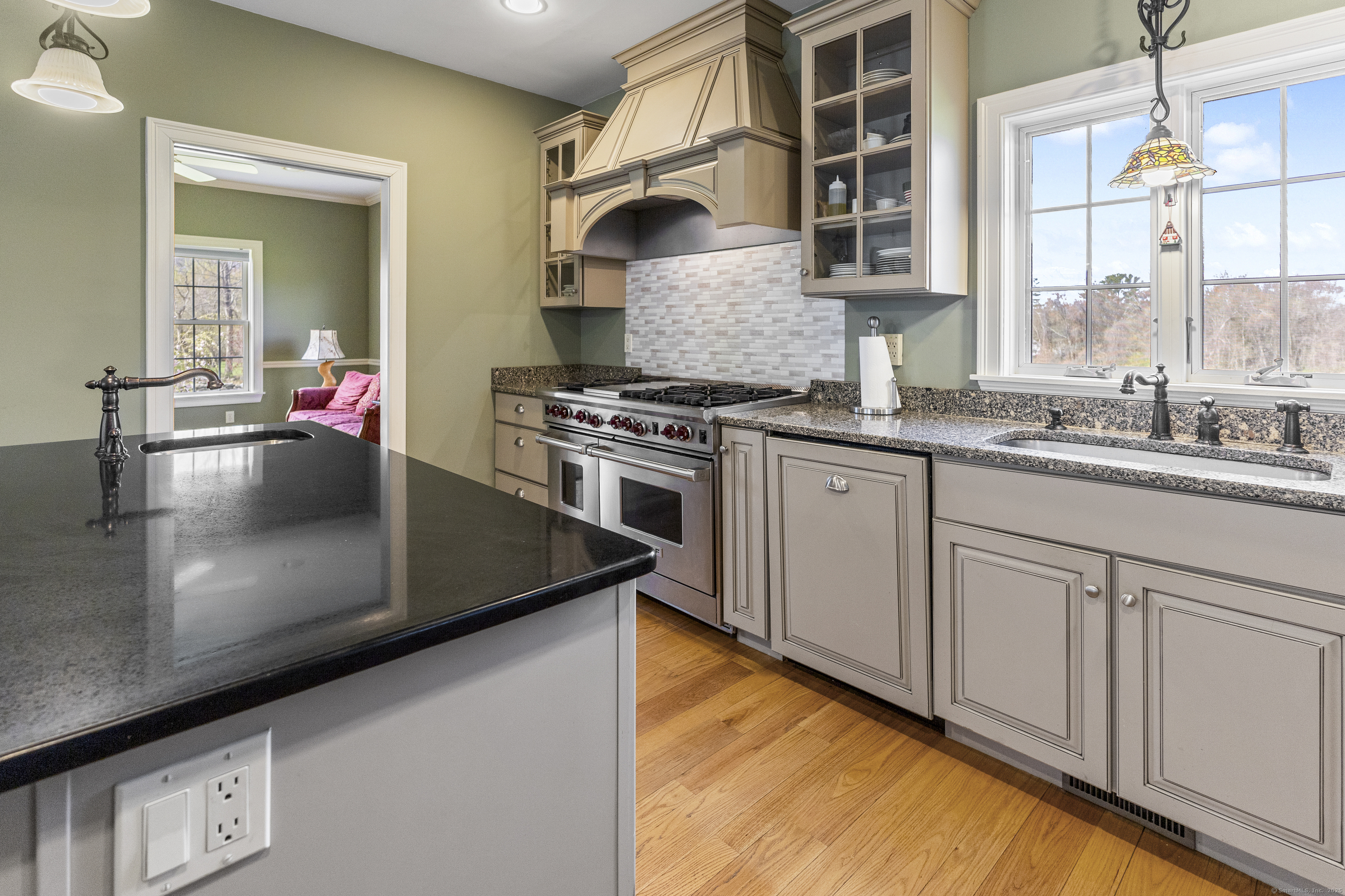 267 Chase Road Thompson, CT 06277 - Photo 9 of 32 a kitchen with stainless steel appliances granite countertop a sink stove and cabinets