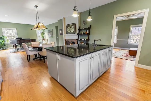a kitchen with counter space and wooden floor